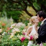 wedding couple kissing in a garden
